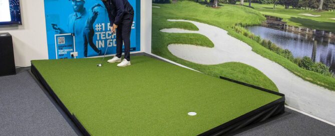The Belfry's Dan Warwick putts on the adjustable Zen Green Stage in the VIP Bay.
